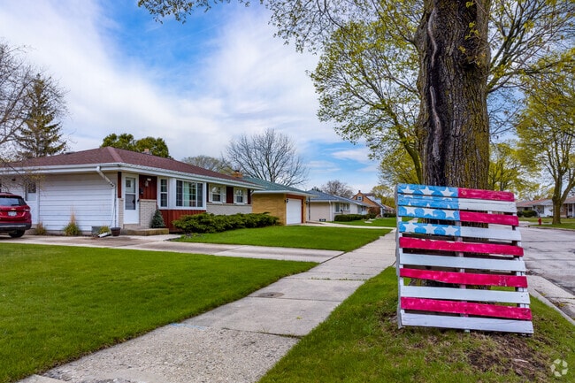 A sidewalk view of neighborhood art in  Root Creek.