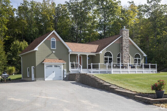 This custom home in Strafford exudes a timeless warmth.