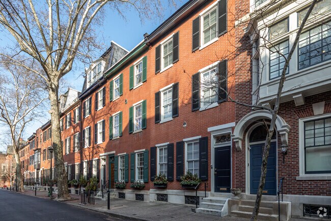 The Fitler Square neighborhood features predominantly three-story brick row houses.