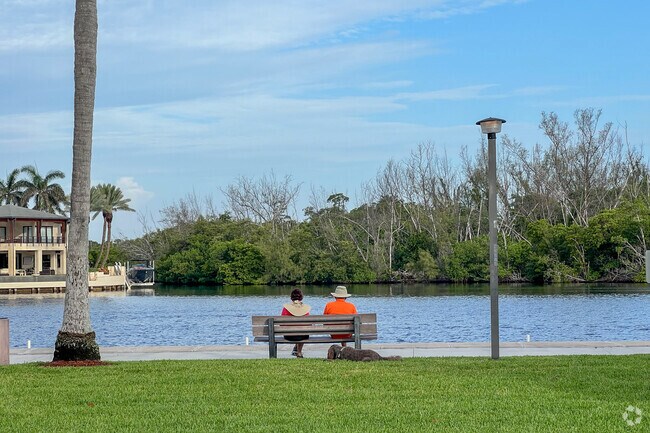 Couple sitting on bench overlooking the intercostal waterway