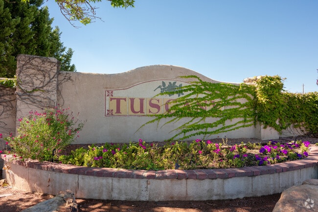 Tuscany entrance sign marks the neighborhood near Unser Boulevard.