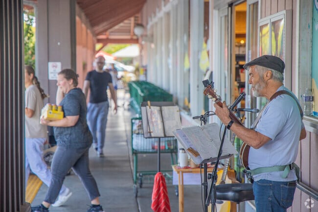 Outside of Oliver's Market, musicians play, bringing musical life to Cotati.