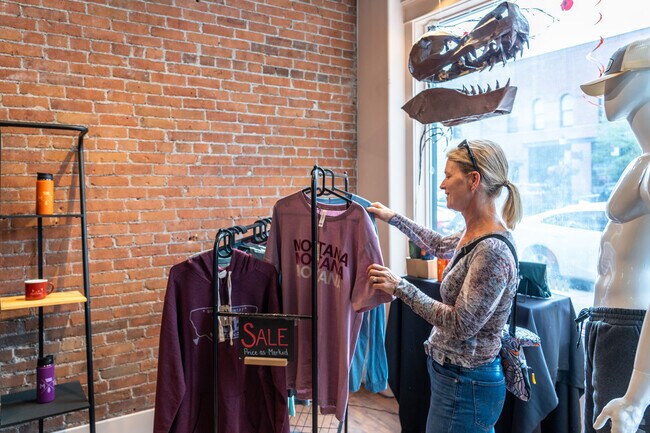 A woman finds some great t-shirts at the Montana Shirt Company near the University neighborhood.