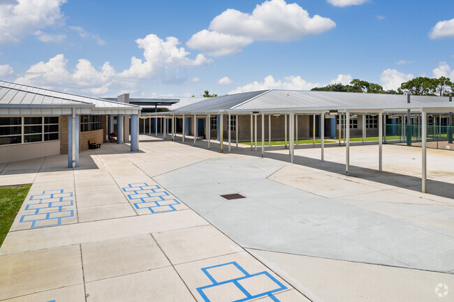 The school pickup lanes at Pinecrest Elementary School in Lehigh Acres have hopscotch activities