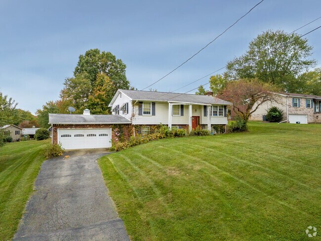A split-level home with a large front yard sits in Big Beaver.