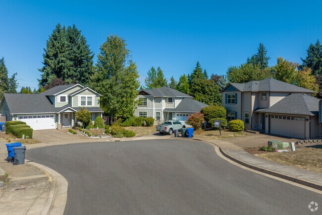 Contemporary homes are surrounded by the trees of the Faye Wright neighborhood.