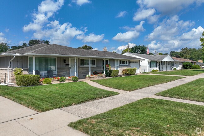 Rows of homes sit on large lots with covered porches in Swanson Park.