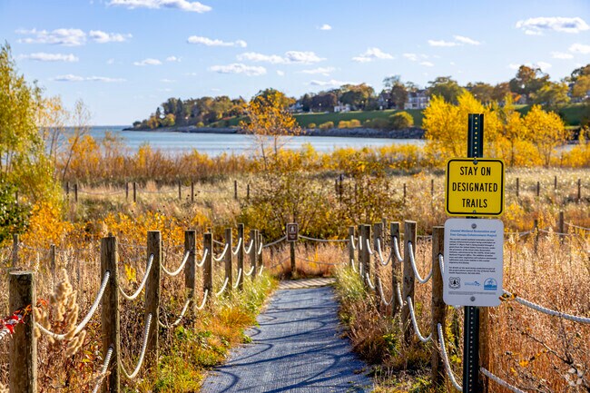 Gravel trails lead through nature areas at Samuel Myers Park and meet at the beach.