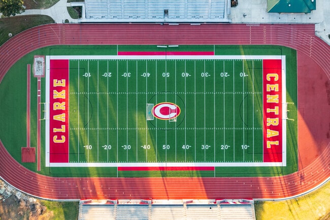 Clarke Central High School showcases a vibrant football field.
