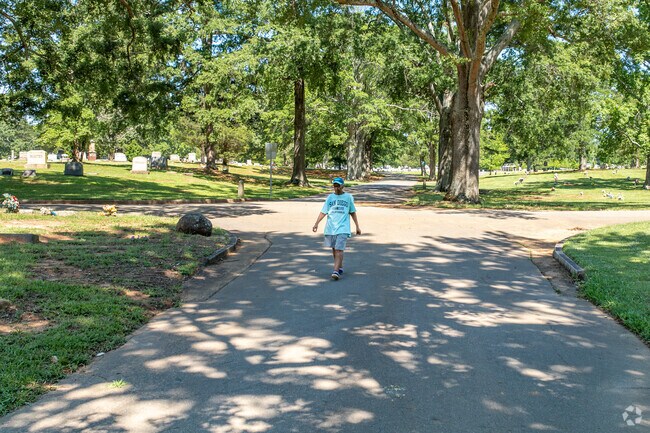 The Oaklawn Cemetery has large trees that give walkers a break from the Sun.