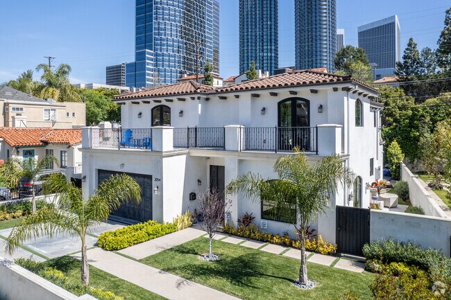 Mediterranean-style home with 2 car garage is prime real estate in Century City.
