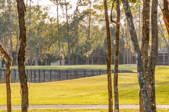 Eagles golf course greenway with lake feature.
