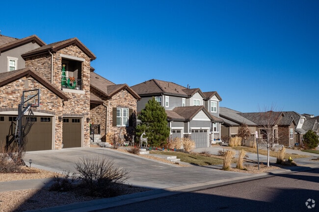 Large craftsman homes with stone detailing are a staple of Candelas, Arvada, Colorado.