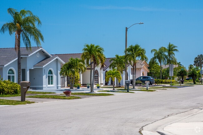 Palm-lined streets feature single-family homes in Kendale.