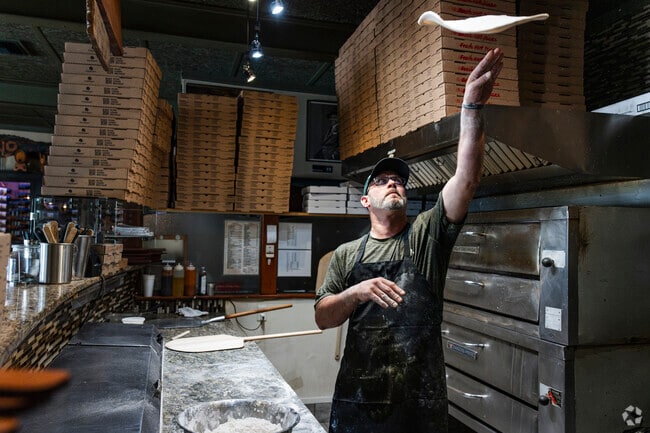 Try a hand tossed pizza or other Italian classics at Baci Pizzeria Ristorante in Fairway.