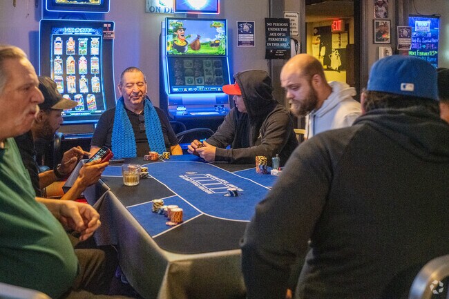 Enjoy a drink and play poker at Paulie’s Pub near the Hungry Hill neighborhood.