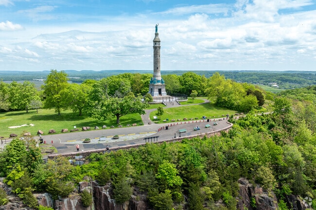 Residents walk up to the Soldiers and Sailors Monument in East Rock to enjoy spectacular views.