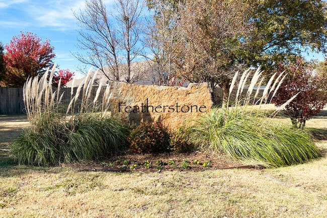 The Featherstone entrance is flanked by stone signage.