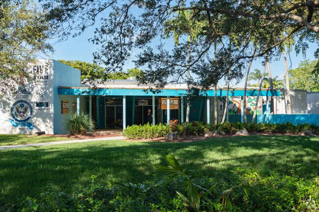 The iconic teal blue of Kendale Elementary Schools main entrance.