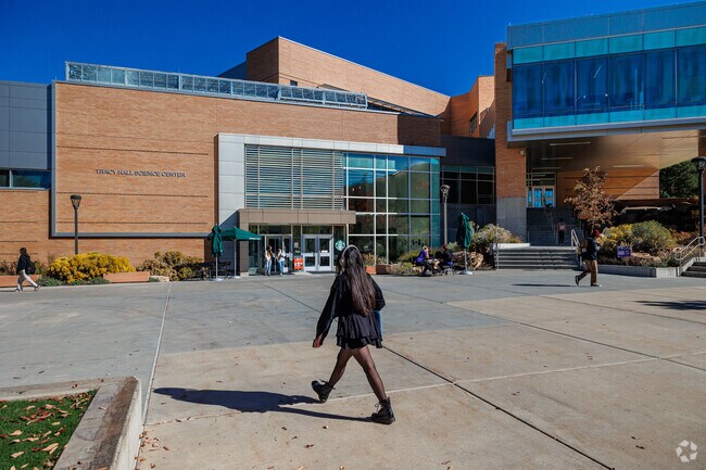 Students walk in front of Tracy Hall Science Center at Weber State University.