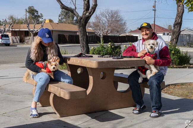An Avenal couple enjoy walking their furry friend down to the Avenal Neighborhood Park.