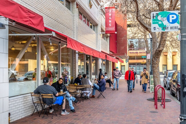 People are enjoying a wide selection of eateries in Old Oakland's Swan's Market.