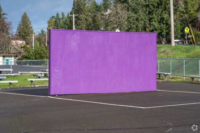 Charlemagne French Immersion Elementary School has a purple wall for outdoor games in Eugene.