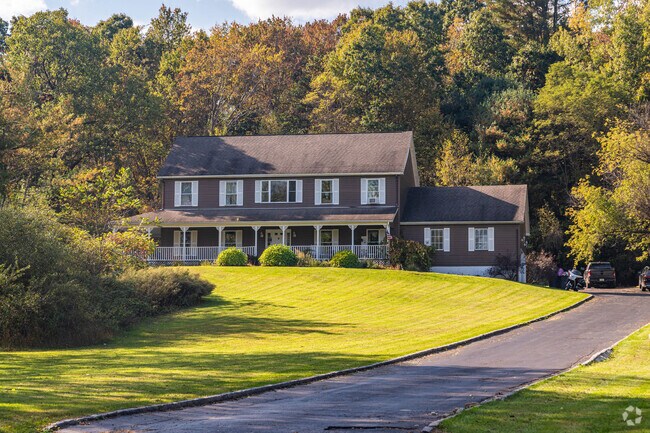 Large colonial homes with long driveways can be found around Sandyston.