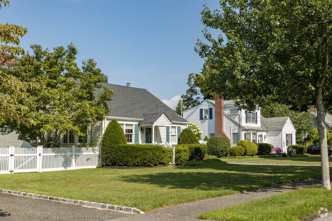Cape cod style homes tend to line the streets on the north end of town in Bellport, NY.