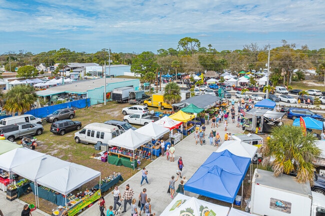 Residents walk through the farmers' market in East Englewood on Thursdays.