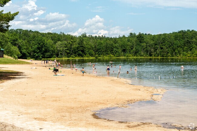 The beach on Sand Spring Lake is a popular spot for families enjoying Hickory Run State Park.
