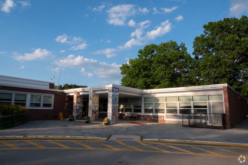 Beautiful, mosaic murals line the pillars at the Claypit Hill School entrance in Wayland, MA.