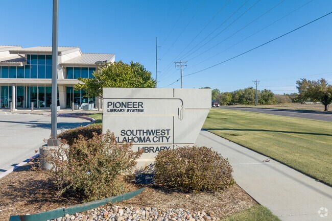 Read a good book at the Southwest Oklahoma City Library near Stone Meadows.
