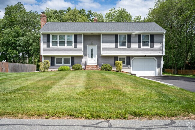 Discover the charm of North Swansea's beautiful raised ranch home style.