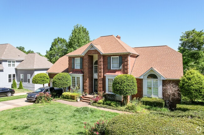 A brick home with columns in Davis Lake.