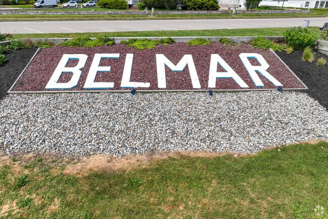 A large bright sign welcome visitors to Belmar.