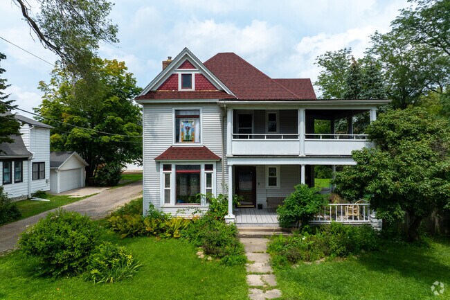 Victorian home amid mature trees near historic downtown Byron.