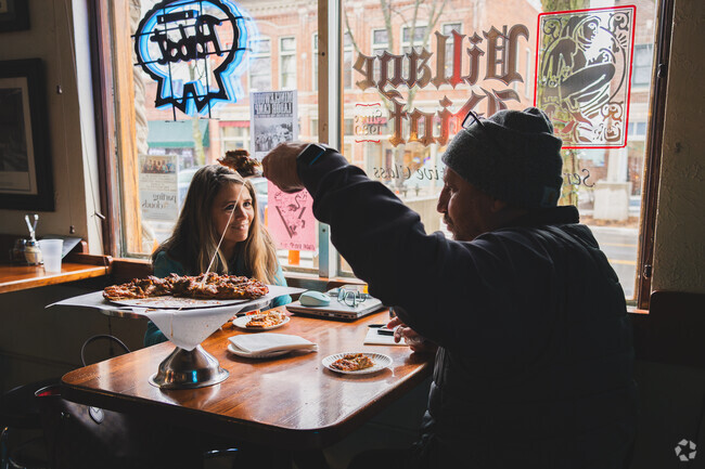 Taking that next piece of pie at The Village Idiot in Uptown Maumee, voted Best Pizza.