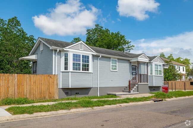 New contemporary raised cottages replace vacant land affected by the hurricanes in Plum Orchard.