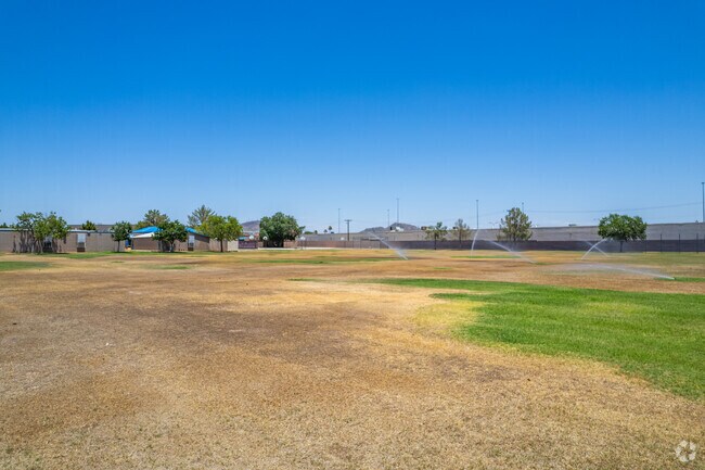 Engage in outdoor activities on the open field at Washington Elementary in Phoenix.