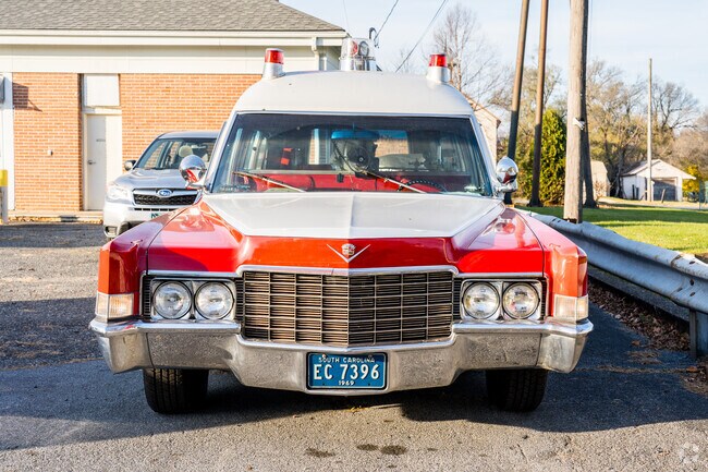 An old ambulance stands as a testament to bygone eras in New Morgan, PA.