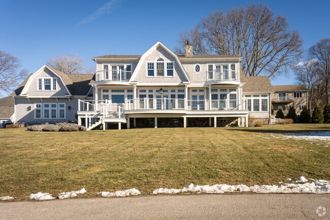 Explore stunning beach mansion homes with private beach access and water views in East Passage Estates.