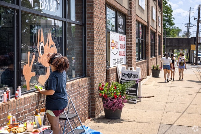 A window mural being painted by the artist Gendakiwi in downtown Dunellen, NJ.