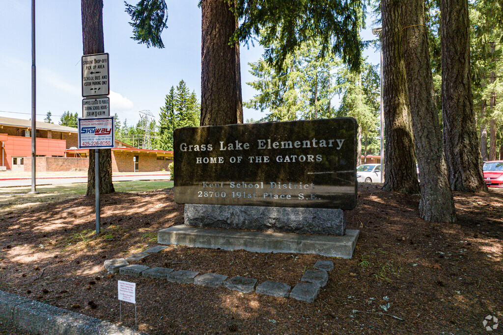 The Grass Lake Elementary School sign welcomes students as they enter.