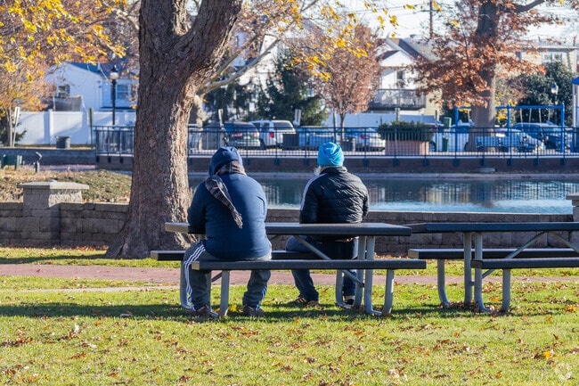 Carteret Park offers shaded benches for resting after play or enjoying the view.