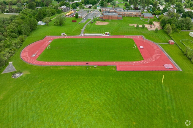 Deruyter High School has a large green space for student activities.