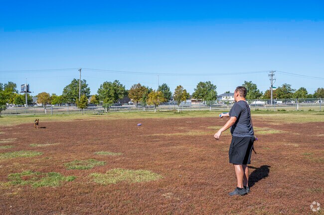 The wide open spaces for your large dog is a great place to play fetch at Village West Dog Park.