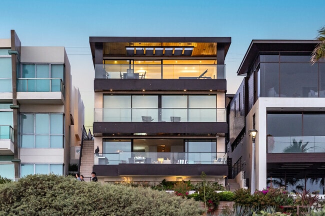 Modern beach front homes with large windows are distinctive for Manhattan Beach.