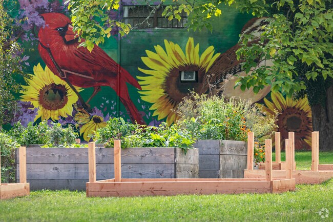 Mighty Park’s raised beds support neighborhood produce and flowers.