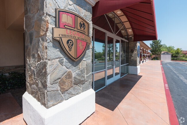 The Legacy Christian Academy's  Crest is proudly displayed on the school building in Valencia.